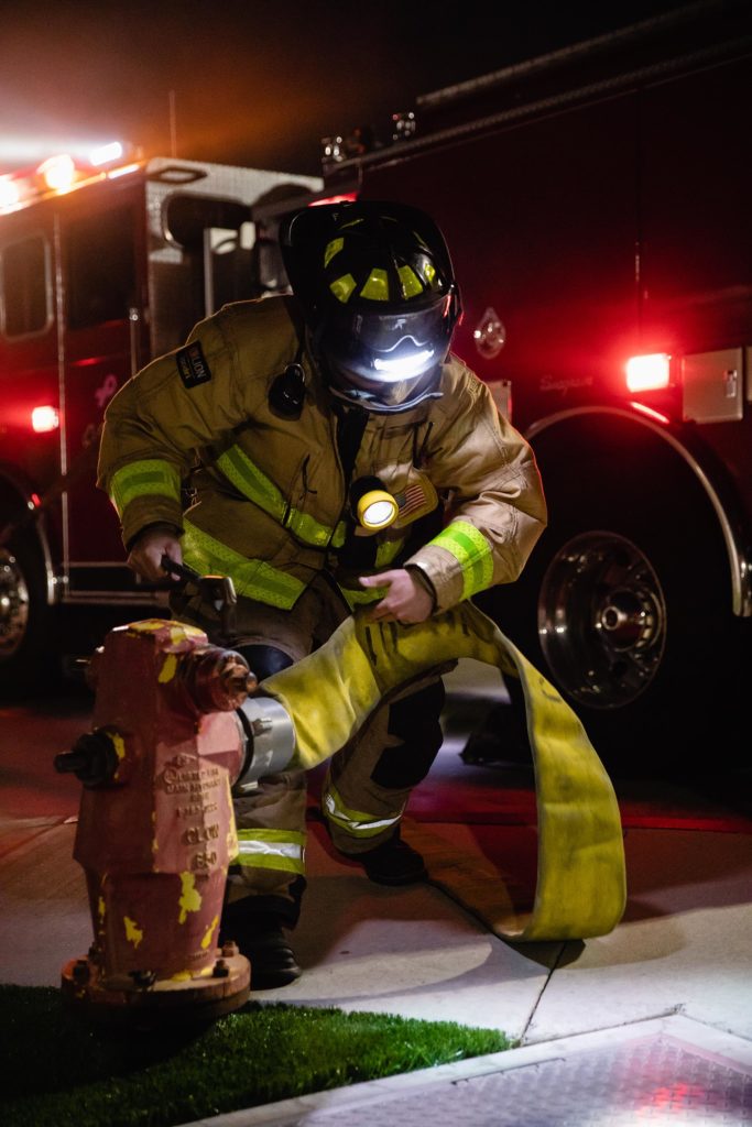Firefighter utilizing redundant lighting, Structure Fire Kit