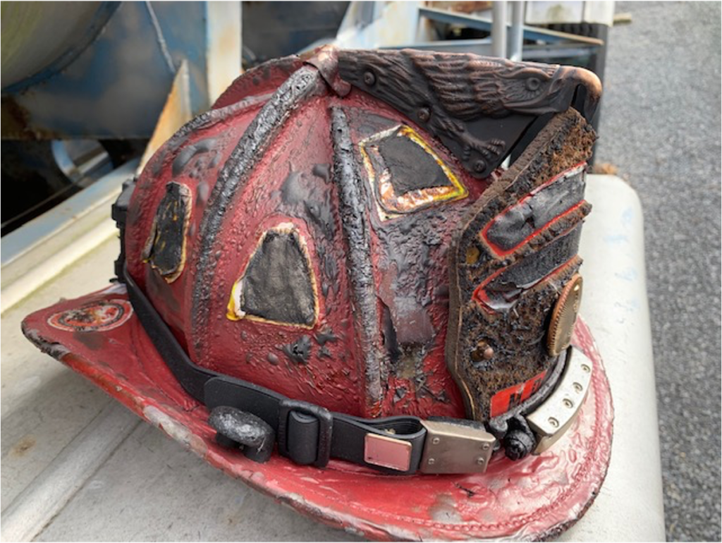 Leather helmet severely burned from flashover. FoxFury Discover still working